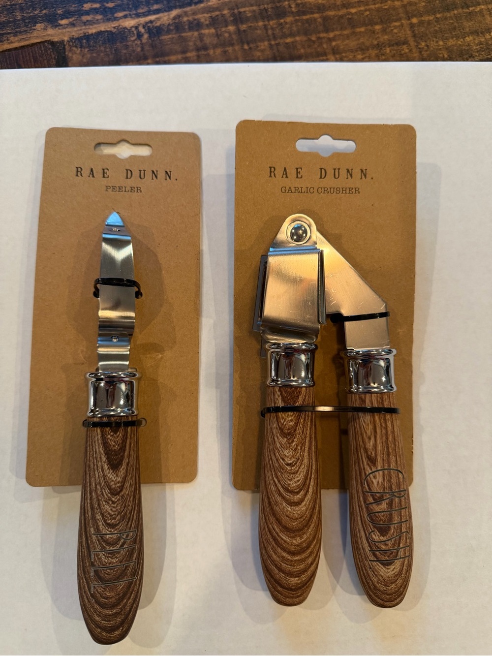 Rae Dunn Stainless Steel Peeler & Garlic Crusher with Wood-Grain looking Handles
